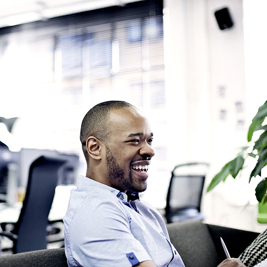 Man in office smiling