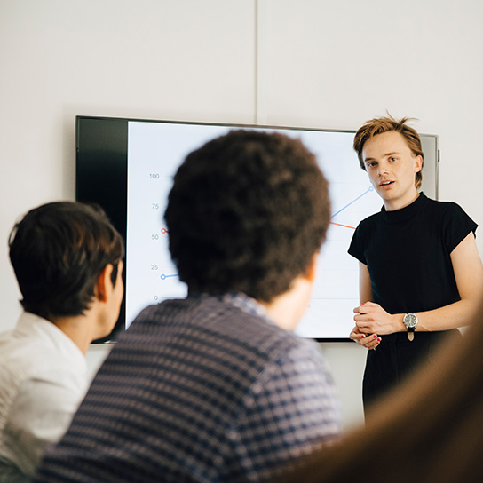 Young person presenting in an office