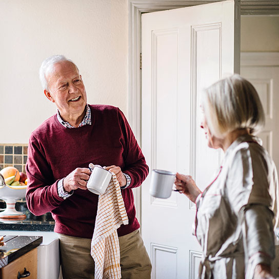 Older man and woman interacting in the home