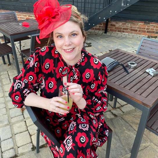 Rebecca Kudyk wearing red patterned dress