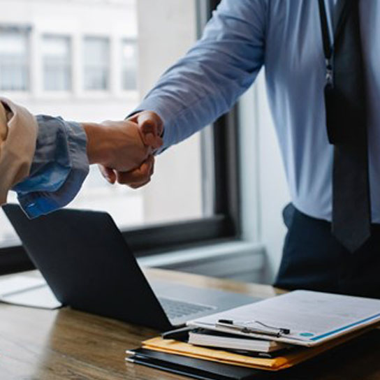 Two brokers shaking hands