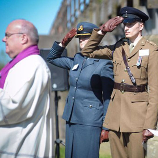 Colleague Ian Dawes, RSA Armed Forces Co-chair, and Non-Executive Director Sally Bridgeland salute during the Last Post at the RSA War Memorial rededication service at the National Memorial Arboretum.