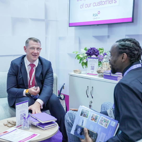 Photo of RSA colleagues at AIRMIC 2025, hosting a meeting