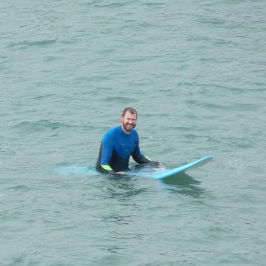 Peter Clark with surfboard