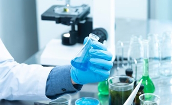 Close up of person with chemicals doing an experiment