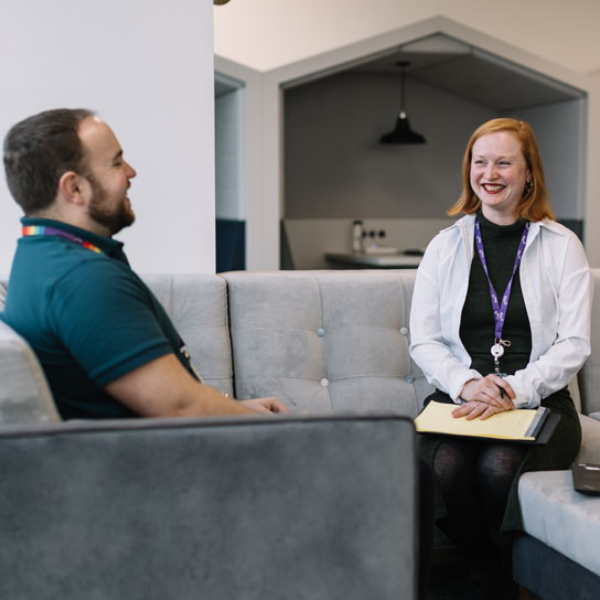 Man and woman in seated area in RSA London office