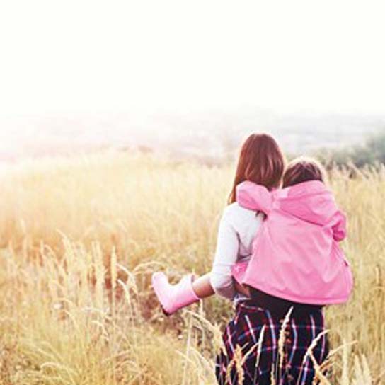 Lady with young girl on back
