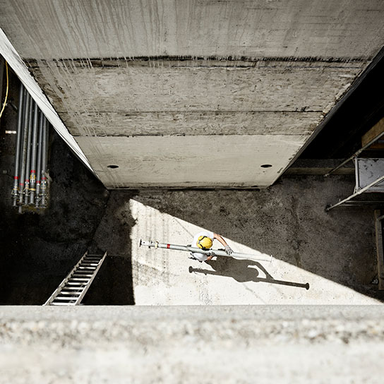 Aerial shot of construction worker carrying materials