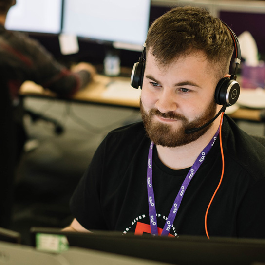 Man in call centre in Peterborough office