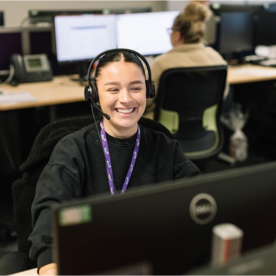 Woman wearing a telephone headset