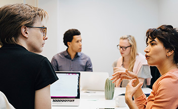 Young people interacting in an office