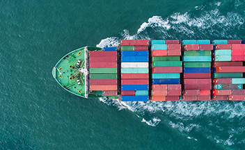 Aerial shot of green ship transporting cargo