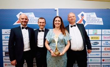 Photo of RSA colleagues accepting their award at the 2025 British Insurance Awards