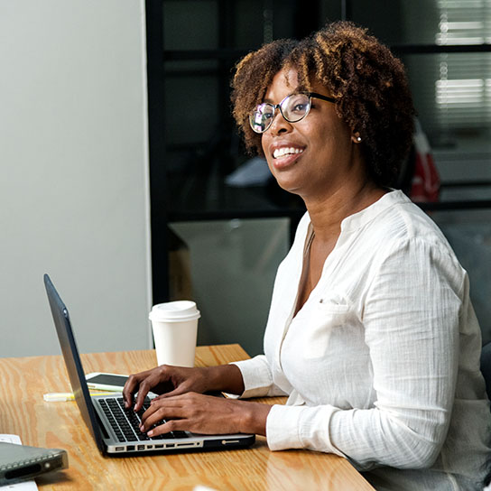 Woman on a laptop in an office