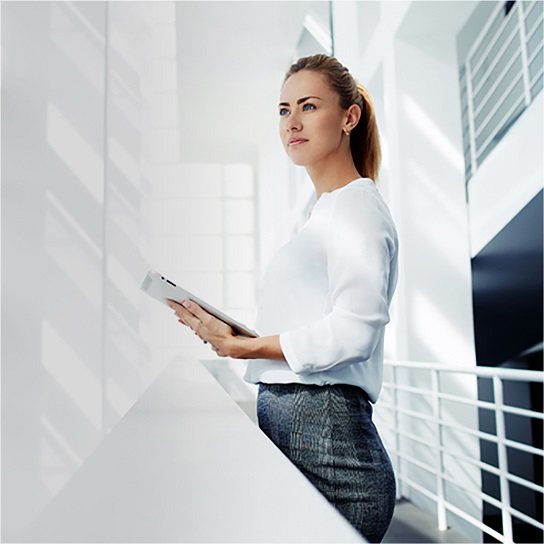 Woman in stairwell with ipad