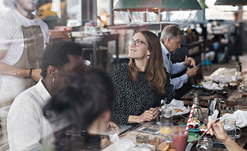 People sat in a restaurant at a table