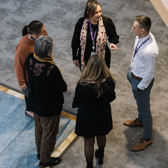 Aerial shot of multiple colleagues talking in Peterborough office 02