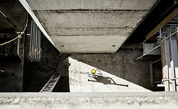 Aerial shot of construction worker carrying materials