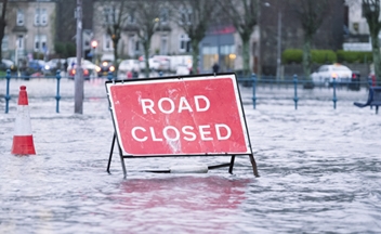 Road closed sign on a flooded road