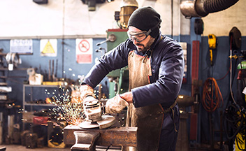 Trade worker using power tools