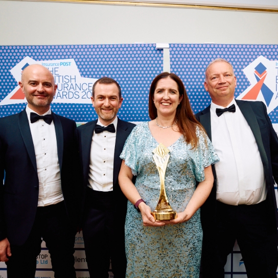 Photo of RSA colleagues accepting their award at the 2025 British Insurance Awards