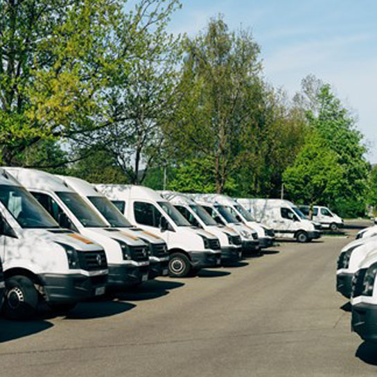 White vans parked in car park