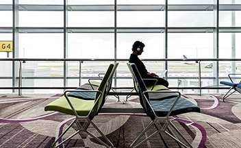 Man waiting for flight in airport
