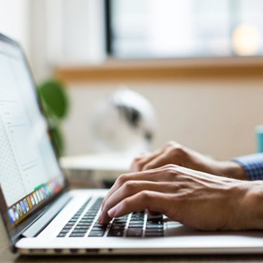 Close up of person using laptop