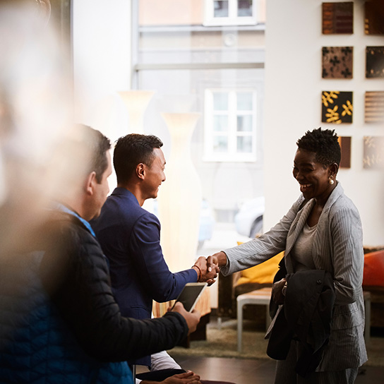 Handshake in a coffee shop wearing formal attire