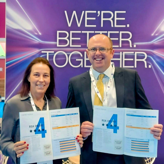 RSA colleagues at BIBA 2024 holding Insurance Times e-trade survey results