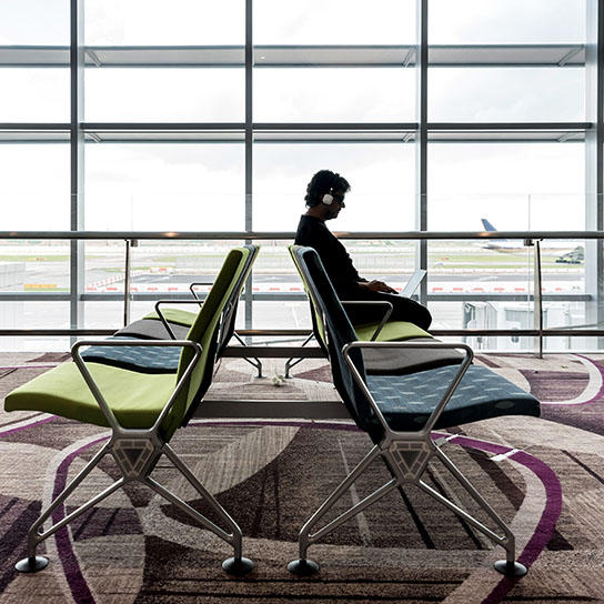 Man waiting for flight in airport