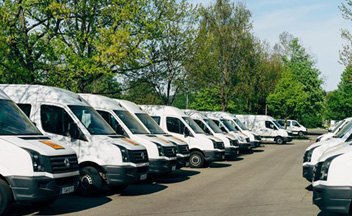 White vans parked in car park