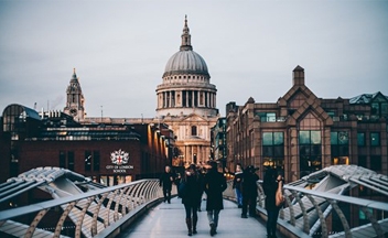 People walking in London in front of landmark