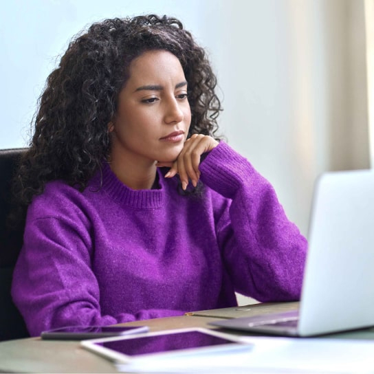 Woman looking at her laptop