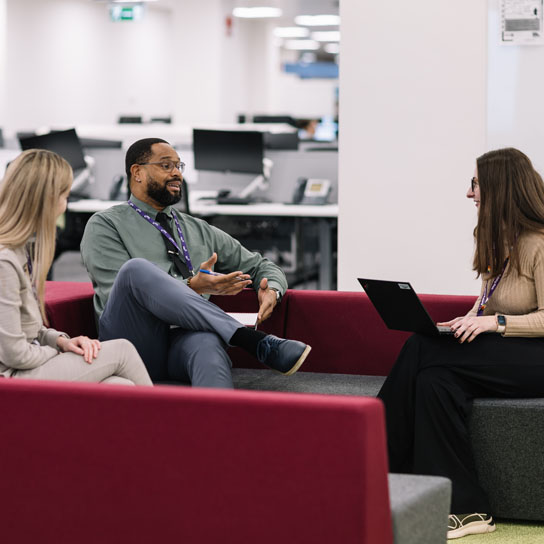 People sat down talking in Liverpool office