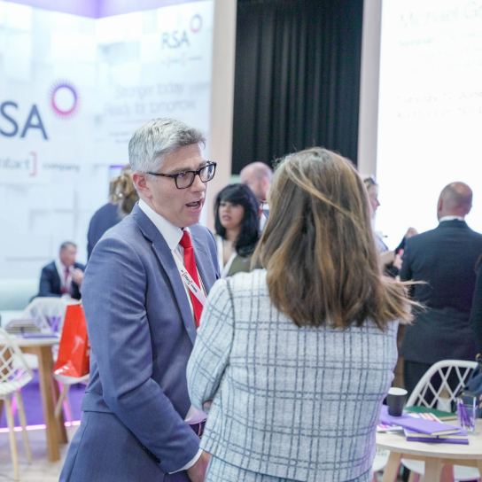 Photo of RSA colleagues at AIRMIC 2025, featuring some of our colleagues in discussion