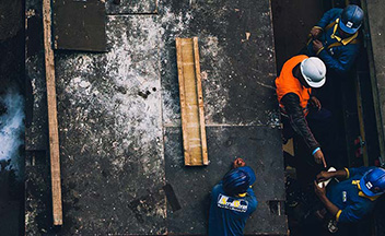 Construction workers with materials