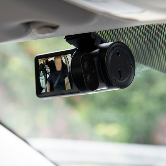 Lytx ai dashcam in place in vehicle, showing image of driver